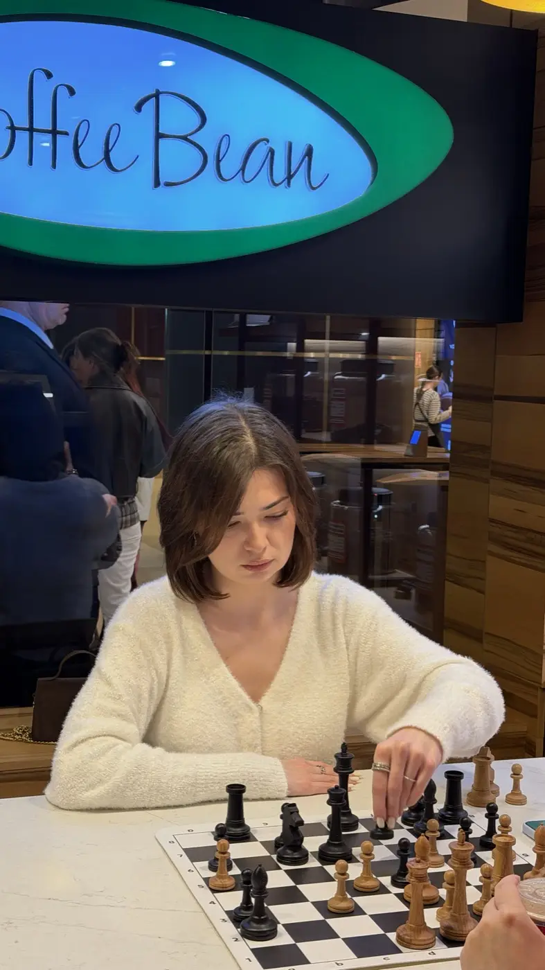 A player in a white sweater making a move