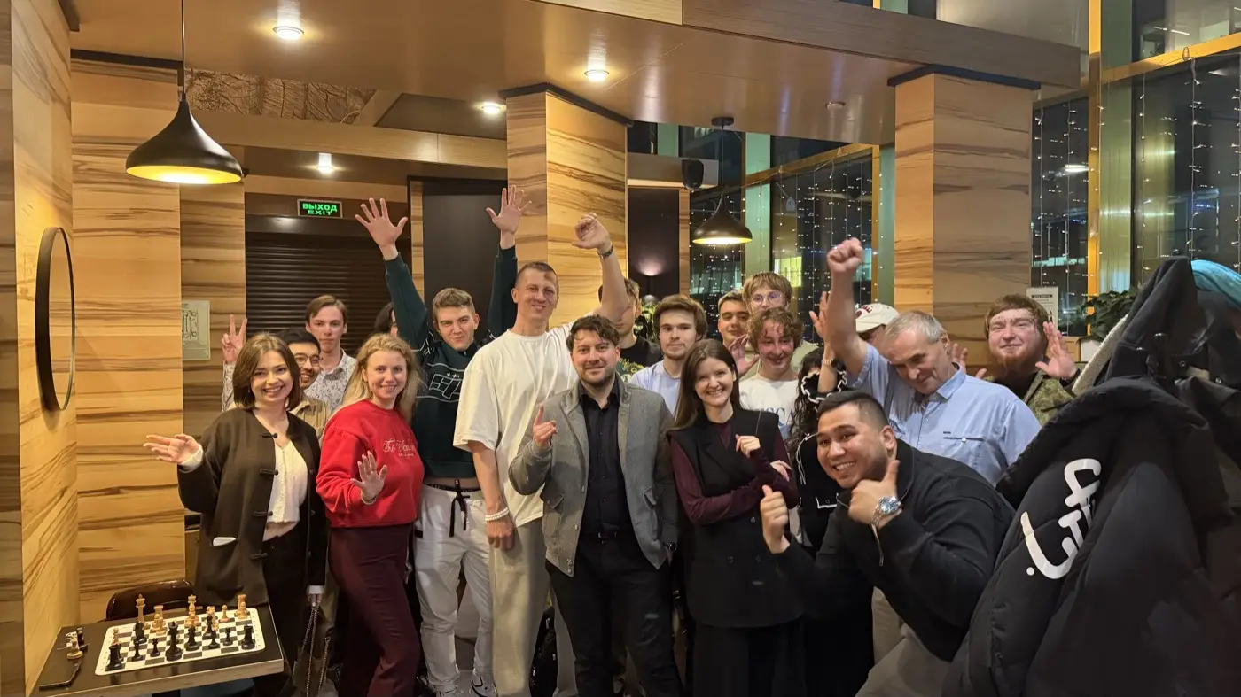 Tournament players waving at the camera after the last round