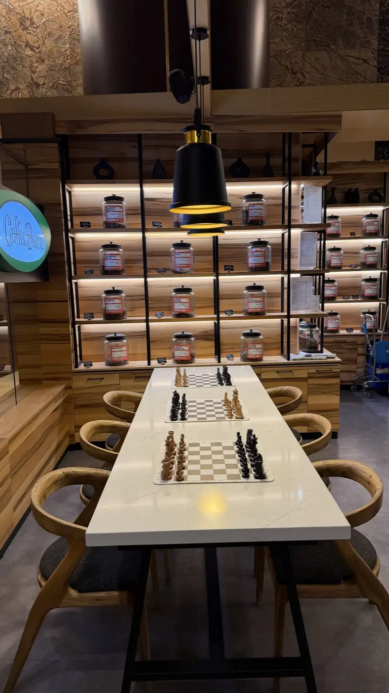 A long table in Coffee Bean with three boards ready for play
