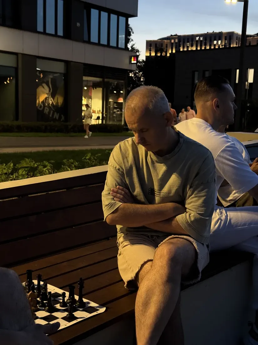 An evening game of chess with a view over the city